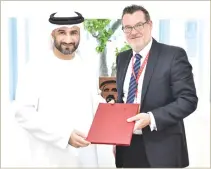  ??  ?? The agreement was signed by Abdul Baset Al-Janahi, CEO of Dubai SME, and Jeff Walsh, general manager of DHL in the UAE.