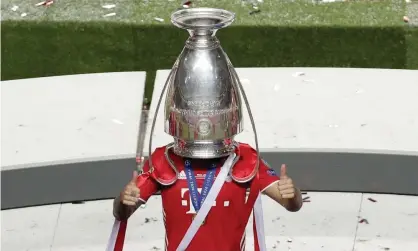  ??  ?? Bayern Munich’s Lucas Hernández celebrates with the Champions League trophy last season. Photograph: Manu Fernández/EPA