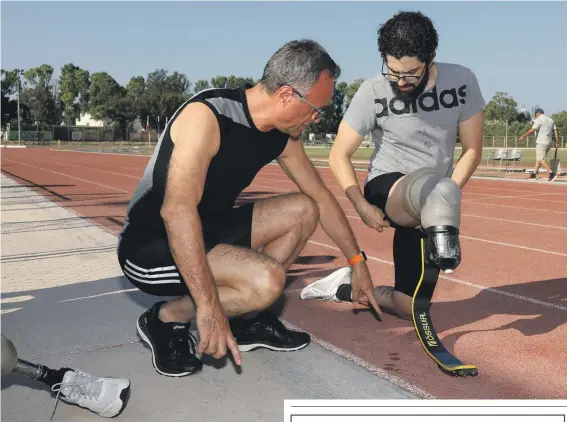  ??  ?? Antonio Flores (left) showing Paolo Catalfamo his latest acquisitio­n — a sprint specific blade, which he has been training with and which he hopes will help secure him a spot in Tokyo 2020.