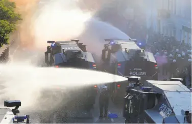  ?? Michael Probst / Associated Press ?? Police used water cannons during a protest against the G-20 summit in Hamburg, northern Germany.