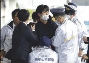  ?? ASSOCIATED PRESS ?? A man who was later identified as Ryuji Kimura is arrested after what appeared to be a pipe bomb was thrown at Japanese Prime Minister Fumio Kishida during his visit Saturday, at a port in Wakayama, western Japan.