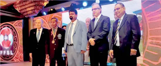  ??  ?? P.D. Sirisena was honoured for his yeomen services to football by FFSL during a reception held for then FIFA boss Joseph Sepp Blatter in 2014 - File pix