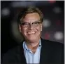  ??  ?? Aaron Sorkin, writer/director of “The Trial of the Chicago 7,” poses at the drive-in premiere of the Netflix film, in Otober at the Rose Bowl in Pasadena, Calif. Sorkin is nominated for Golden Globes for his screenplay and direction.