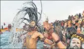  ?? PTI ?? Naga Sadhus take a holy dip during the Kumbh Mela, in Allahabad on Tuesday.