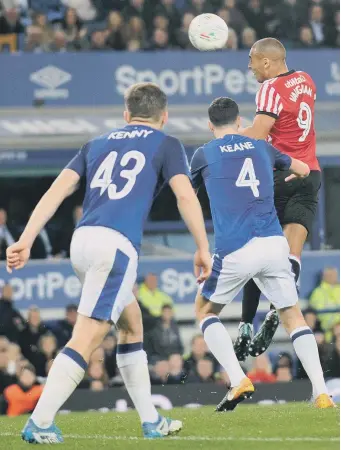  ??  ?? James Vaughan rises to get a header in on goal