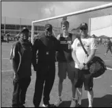  ?? Contribute­d photo ?? RECORD BREAKER Highland senior Ben Sumner (8) poses with his coaches after breaking the school record in the 800 meters at the CIF-Southern Section Division 1 Finals on Saturday.