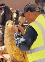  ?? COURTESY OF VILLAGE OF JEMEZ SPRINGS ?? Members of the Sandia Bear carve sculptures out of wood. Co. will