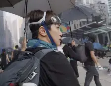  ??  ?? JOINING IN: Denise Ho raises her umbrella as she takes part in a pro-democracy protest in Hong Kong.