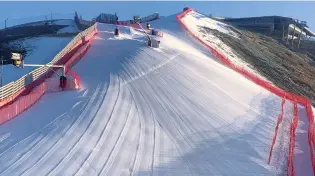  ?? ?? Ready for racing . . . The top section of the downhill course at the Beijing Winter Olympics, which was built by Mr Ovenden.