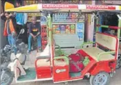  ??  ?? An erickshaw wrapped in yarn in Bhadohi district in Uttar Pradesh prompted many onlookers to ask the artists to ‘decorate’ their shops, windows and bikes too.