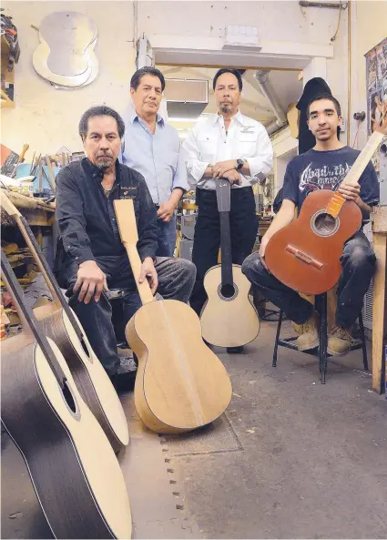  ?? JIM THOMPSON/JOURNAL ?? From left, brothers Robert, Rick, Victor Pimentel and Robert Pimentel III in the family’s workshop at Pimentel &amp; Sons Guitar Makers.