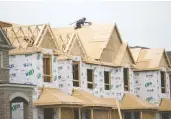  ?? TYLER ANDERSON / NATIONAL POST FILES ?? The Canadian Real Estate Associatio­n said the average price of buying a house jumped almost
26 per cent between June 2020 and June 2021.