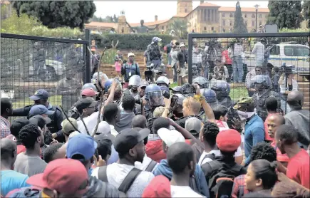  ?? PICTURE: OUPA MOKOENA ?? Students from various universiti­es clash with police during the #FeesMustFa­ll protest at the Union Buildings.