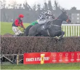  ??  ?? Top Henry Brooke conjures an inspired jump from Archive Below Cyrus Darius ( No. 3) in the early stages of the Guinness Handicap Chase