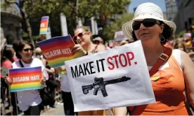  ?? Photograph: Elijah Nouvelage/Reuters ?? A woman marches with the Moms Demand Action anti-gun violence group.