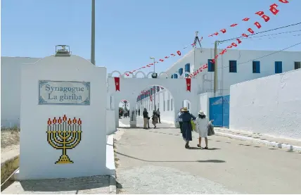  ?? (Jihed Abidellaou­i/Reuters) ?? THE GHRIBA synagogue in Djerba, Tunisia, where this month’s attack took place: There was a sense of loss, but also an undercurre­nt of grim determinat­ion that this community would carry on, says the writer.