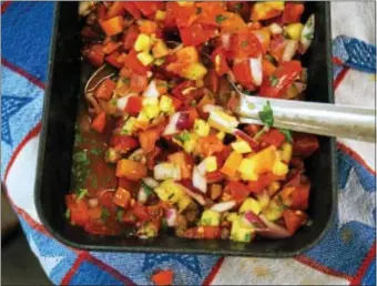  ?? PHOTO BY EMILY RYAN ?? For a twist on tradition, try this fresh tomato and pineapple salsa from Weaver’s Orchard.