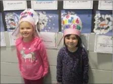  ?? SUBMITTED BY WENDY LEDFORD ?? Kindergart­en students at Schwenksvi­lle Elementary celebrated the day with many fun learning activities. Kaitlyn Grebe and Josephine Hurt in Mrs. Ame Tanski’s kindergart­en class wear their 100-day crowns.