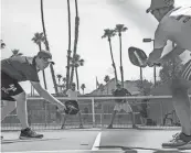  ?? JAY CALDERON/THE DESERT SUN ?? People play the fast-growing sport of pickleball on courts last year in Demuth Park in Palm Springs, Calif.