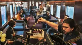  ??  ?? Filming a scene in one of the specially made carriages