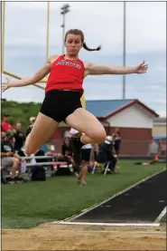  ?? DAVID C. TURBEN — FOR THE NEWS-HERALD ?? Paige Floriea is shown long jumping at the 2019 Division I Austintown-Fitch Regional.
