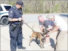  ?? Keith Bryant/The Weekly Vista ?? K9 officer Travis Trammel stands with a lead while Cabo meets Bill Dietman and Jan Dietman, who donated funds to better equip the department’s K9 unit.