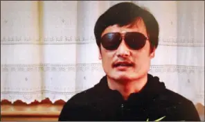  ??  ?? ACTIVIST: In this image made from video, blind legal activist Chen Guangcheng is seen on a video posted to Youtube on Friday by overseas Chinese news site Boxun. com. “I am now free. But my worries have not ended yet,” Chen said in the video that was...