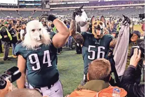 ??  ?? Eagles defensive tackle Beau Allen (94) and defensive end Chris Long (56) celebrate their underdog status after beating the Vikings in the NFC Championsh­ip Game at Lincoln Financial Field. ERIC HARTLINE/USA TODAY SPORTS