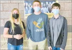  ?? Westside Eagle Observer/SUSAN HOLLAND ?? Nicole Vogt, Bart Walker and Logan Smith, all juniors at Gravette High School, attend the March 15 meeting of the Gravette school board. The three students led the pledge of allegiance to the flag to open the meeting and talked to board members about their experience­s as GHS Student Voice Institute participan­ts. They were recommende­d by faculty members for the institute because of their leadership abilities.