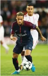  ??  ?? PARIS: Paris Saint-Germain's Brazilian forward Neymar runs with the ball during the UEFA Champions League football match between Paris Saint-Germain and Bayern Munich yesterday— AFP