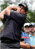  ??  ?? WILMINGTON: Phil Mickelson tees off of the 12th hole during the second round of the Wells Fargo Championsh­ip golf tournament. —AP