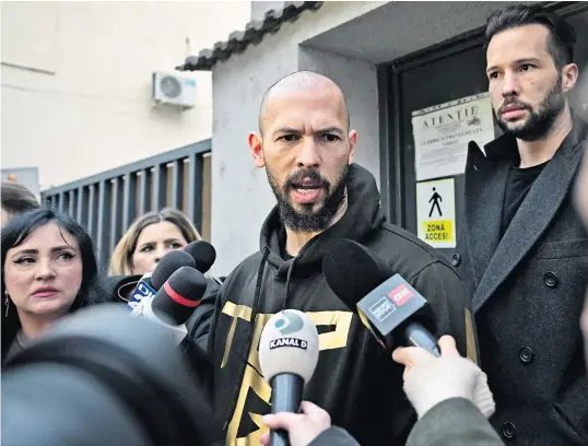  ?? ?? Andrew Tate and his brother, Tristan, right, were released from detention in Bucharest on Tuesday after appearing in court