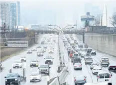  ?? THE CANADIAN PRESS FILES ?? Vehicles makes there way into and out of downtown Toronto. A major effort is underway to collect the most detailed data yet on the state of the country’s roads, bridges, water pipes and transit systems. Statistics Canada launched a national survey late...
