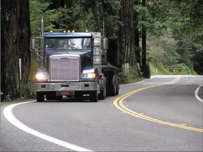  ?? WILL HOUSTON — TIMES-STANDARD FILE ?? A truck drives along a windy stretch of U.S. Highway 101through Richardson Grove State Park in Southern Humboldt. Caltrans is attempting to widen the road through Richardson Grove, though environmen­tal groups say it will harm the nearby redwoods.