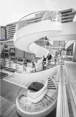  ?? Steve Gonzales / Staff photograph­er ?? An outdoor staircase decorates the Houston Center, downtown’s largest office building. Gensler, the internatio­nal architectu­re firm, is focusing on climate risks, hoping to eliminate all carbon emissions in its work by 2030.