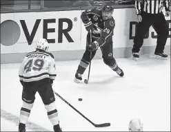  ?? Andy Cross / The Denver Post ?? Ian Cole sends a puck down ice against the Blues on Jan. 13 at Ball Arena in Denver. The Avalanche dealt Cole to Minnesota on Tuesday.