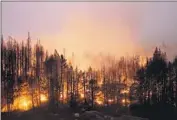  ?? Jae C. Hong Associated Press ?? THE CALDOR blaze, which has consumed 219,267 acres, burns Sept. 3 in the Eldorado National Forest.