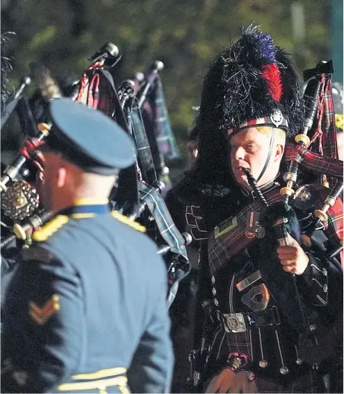  ?? ?? Pipers march along the Long Walk in Windsor yesterday morning during a rehearsal for the Queen’s funeral tomorrow
Picture
Andrew Matthews