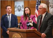  ?? (Arkansas Democrat-Gazette/Staci Vandagriff) ?? Rep. Jon Eubanks, R-Paris, lifts his phone while talking about legislatio­n regarding social media during a news conference with Gov. Sarah Huckabee Sanders (center) at the state Capitol in Little Rock on Thursday.