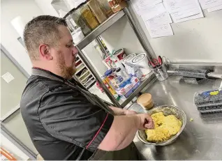  ?? NATALIE JONES/STAFF ?? Originally from a small farming community in Shelby County, Justin Mohler, the owner and baker at Salt Block Biscuit Company, puts a European twist on elevated, comfort food in Dayton’s Fire Blocks District.