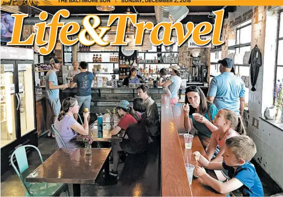  ?? LORI RACKL/CHICAGO TRIBUNE ?? Lexington’s Distillery District is home to Crank &amp; Boom Ice Cream Lounge, a fun spot to indulge in frosty treats like bourbon and honey ice cream.