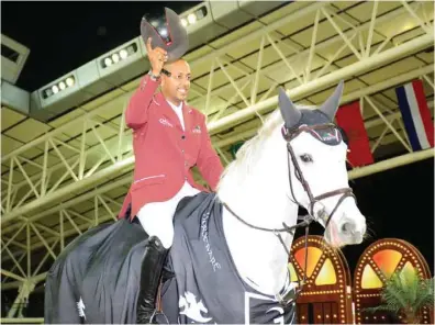  ?? PICTURES: Lotfi Garsi ?? Qatar’s Bassem Hassan Mohamed celebrates his win on Argelith Squid in the CSI5* Against the clock (1.50m) Table A, FEI Art. 238.2.1, at Al Shaqab Arena yesterday.