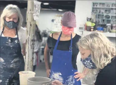  ?? PHOTO COURTESY OF LYNN HOFFMANN ?? Left to right, Jen Fitzgerald and Janet Moore with artist Lynn Hoffmann, whose exhibit at Ambler’s Art in the Storefront is scheduled to run through Sept. 15.