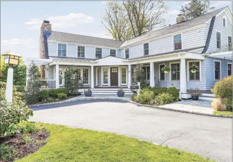  ?? Contribute­d photo ?? This classic 1923 colonial features five fireplaces, a state-of-the-art open concept kitchen, and great flow throughout.