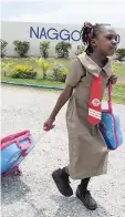  ??  ?? It was an early start for this young lady at the Naggo Head Primary School in Portmore, St Catherine.