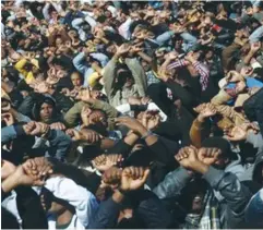  ??  ?? AFRICAN MIGRANTS protest their imprisonme­nt in Holot during a demonstrat­ion in Jerusalem in 2014.