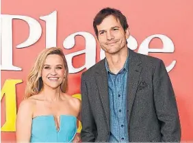  ?? GETTY IMAGES ?? The vibe between Reese Witherspoo­n and Ashton Kutcher at the premiere of their new rom-com “Your Place or Mine?” was so wooden it spurred Mila Kunis to comment to Kutcher: “You guys gotta act like you like each other.”
