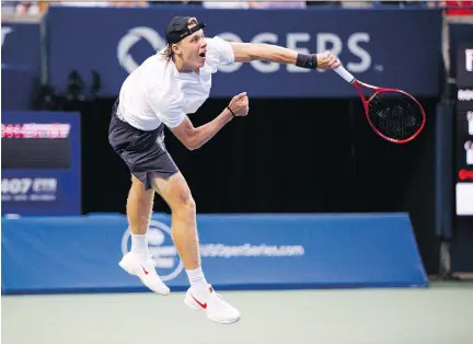  ?? MARK BLINCH/THE CANADIAN PRESS ?? Canadian Denis Shapovalov delivers a serve to France’s Jeremy Chardy during the first round of the Rogers Cup tournament on Tuesday in Toronto. He will face Fabio Fognini in the second round after defeating Chardy 6-1, 6-4.
