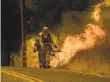  ?? Noah Berger / Associated Press ?? Firefighte­rs light a backfire near Ventura on Saturday.