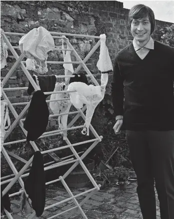  ??  ?? Undie-cover of the night: Charlie Watts with a lingerie-strewn clothes horse